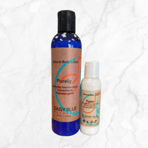 Two bottles of Purely Lotion (8 oz and 2 oz) with brown labels and blue accents are displayed on a white marble background.